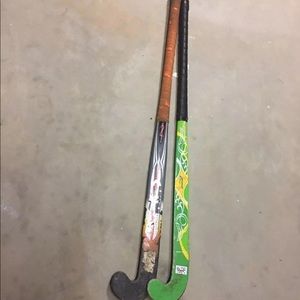 2 field hockey sticks and shin guards 35 and 36 in